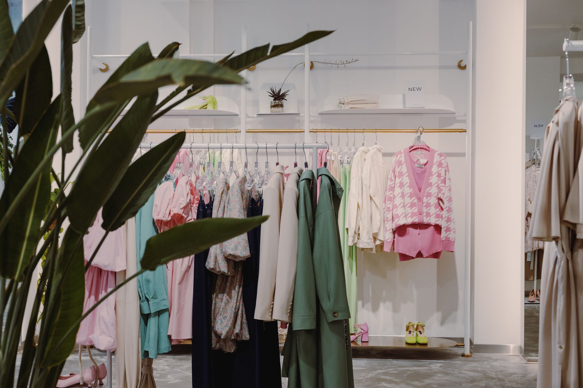 Boutique clothing rail reflecting AI styling tools curated aesthetic selections