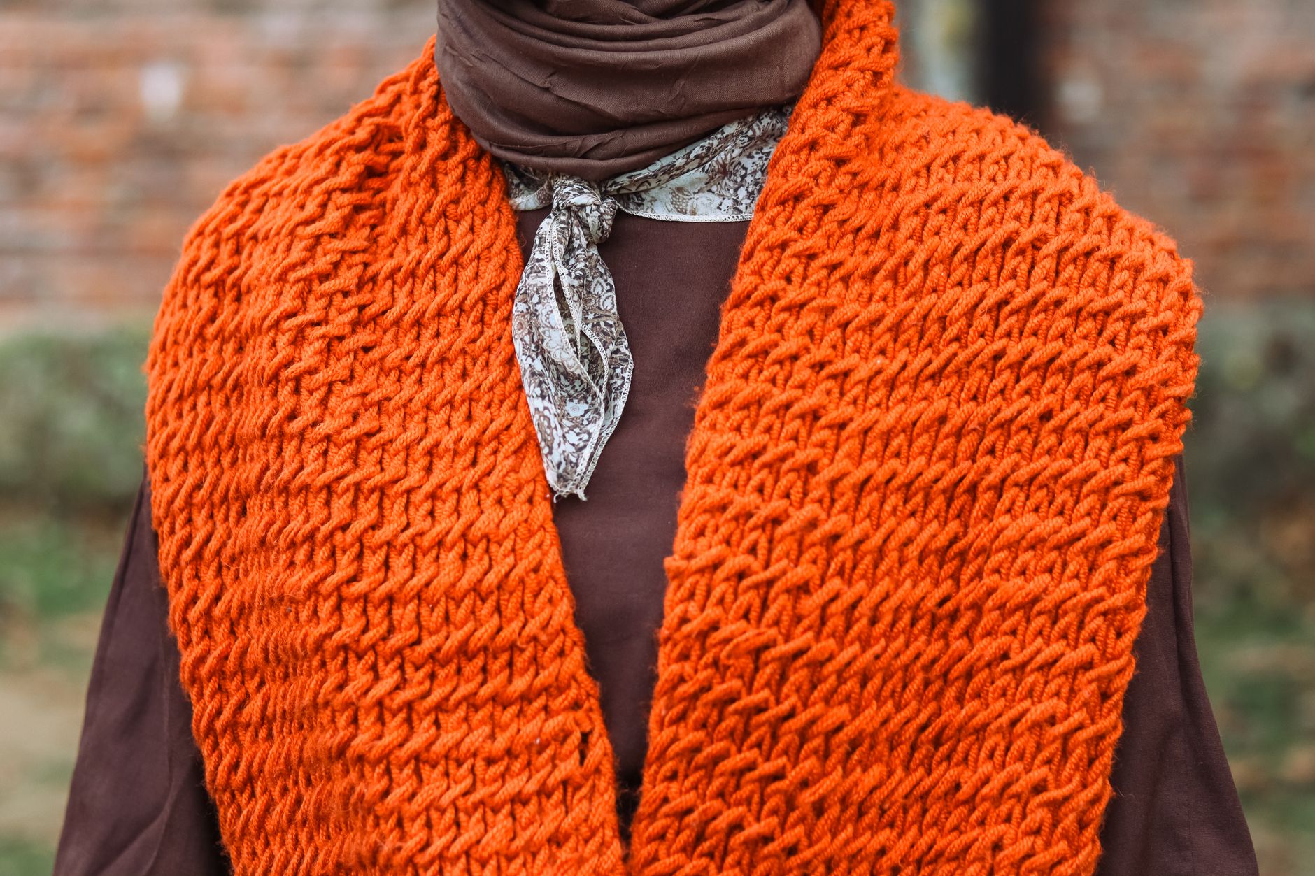 Layered earthy knitwear detail that defines the allotment aesthetic in UK fashion